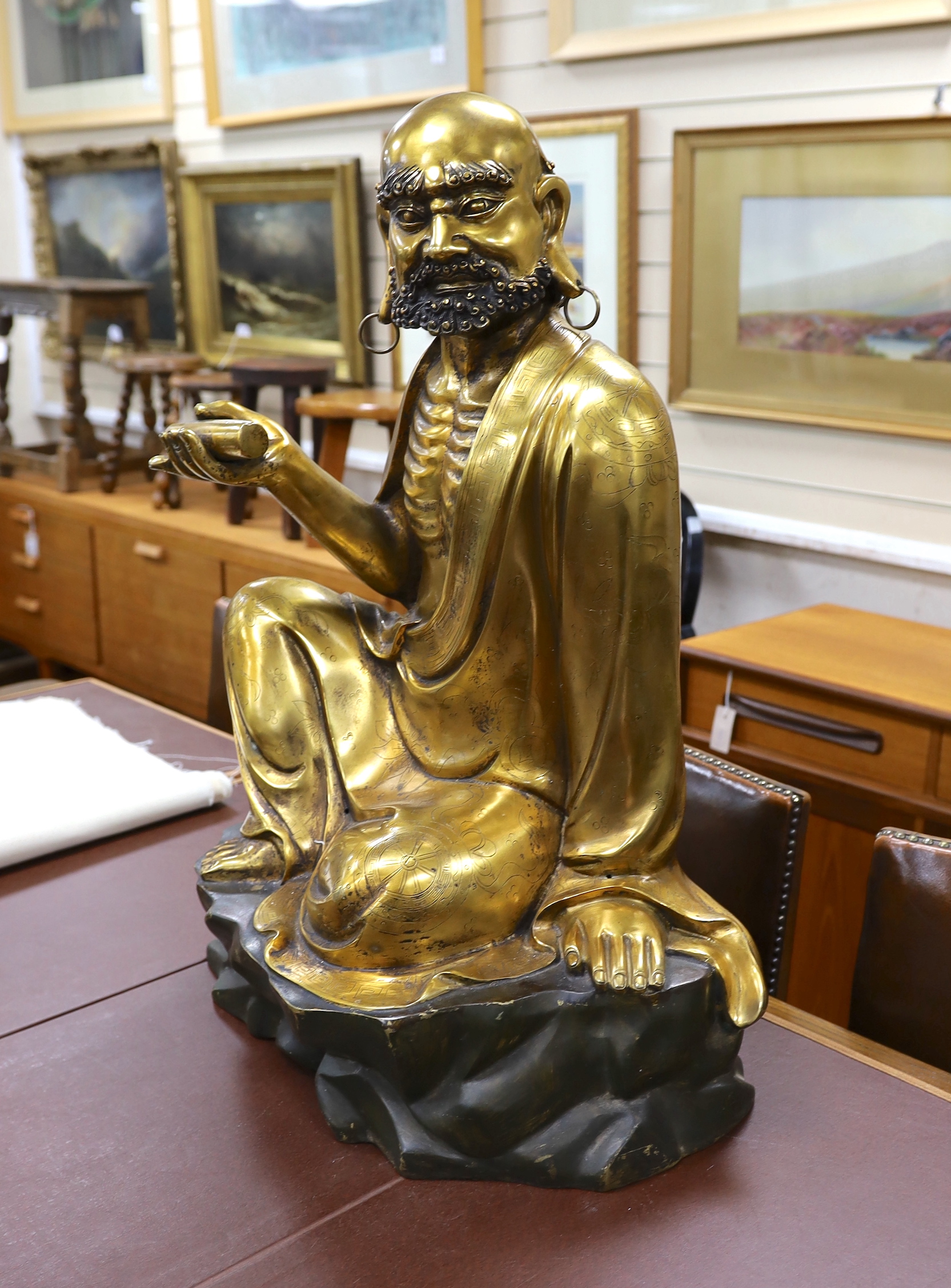 A large Chinese bronze seated figure of a Luohan, 20th century, height 72cm.